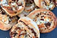Steak and Kraut Pinwheels with Caramelized Onions and White Cheddar