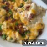 Loaded Cauliflower Casserole close up on a spoon