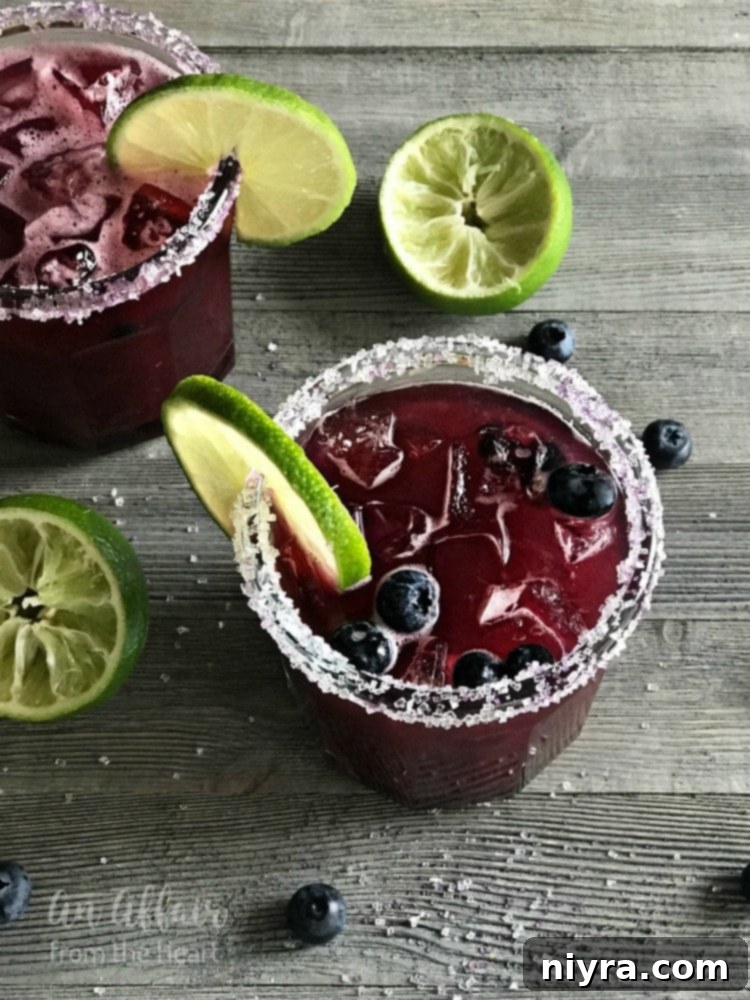 Refreshing Blueberry Margarita made with fresh or frozen blueberries, lime simple syrup, and tequila