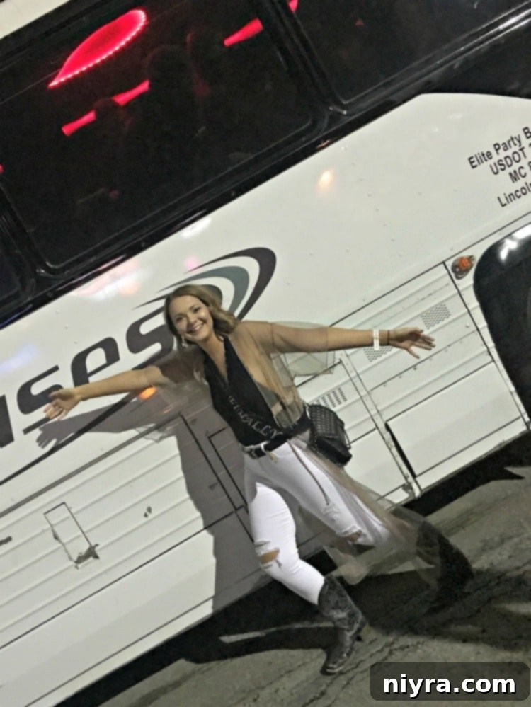 Daughter celebrating her 21st birthday with friends in front of a party bus