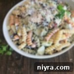 Close up of Creamy Italian Four Bean Pasta Salad in a white bowl