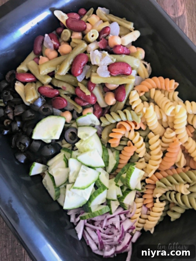 Ingredients laid out for Creamy Italian Four Bean Pasta Salad preparation
