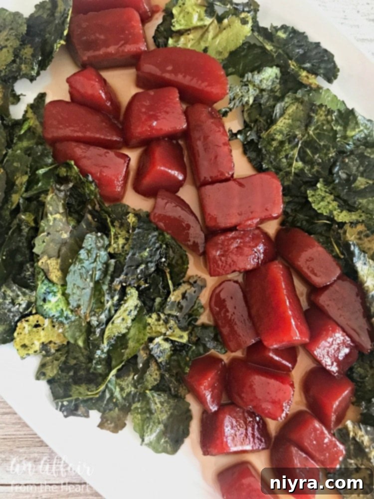 Honey Bourbon Glazed Beets with Crispy Kale beautifully plated, showcasing the vibrant red beets and green kale.