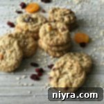 Cranberry Apricot Oatmeal Cookies stacked on a wood table