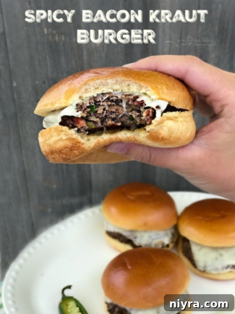 Krautfire Bacon Burger 8 A plate featuring a perfectly cooked Spicy Bacon Kraut Burger, ready to be enjoyed.