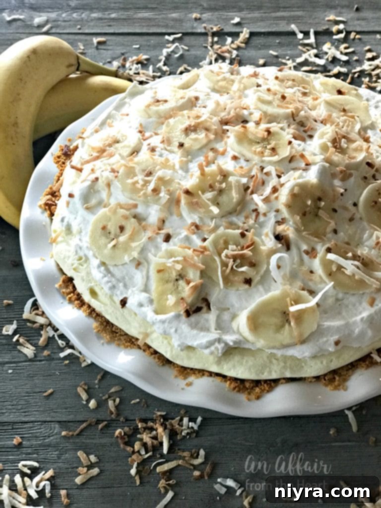 Homemade Banana Cream Pie with whipped cream and toasted coconut
