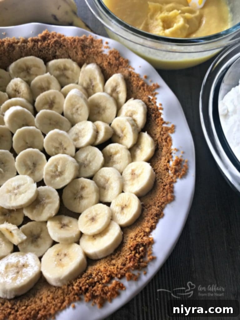 Pressed graham cracker crust in a pie pan, ready for filling