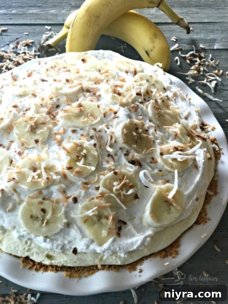 Banana Cream Pie topped with whipped cream, before final garnishes