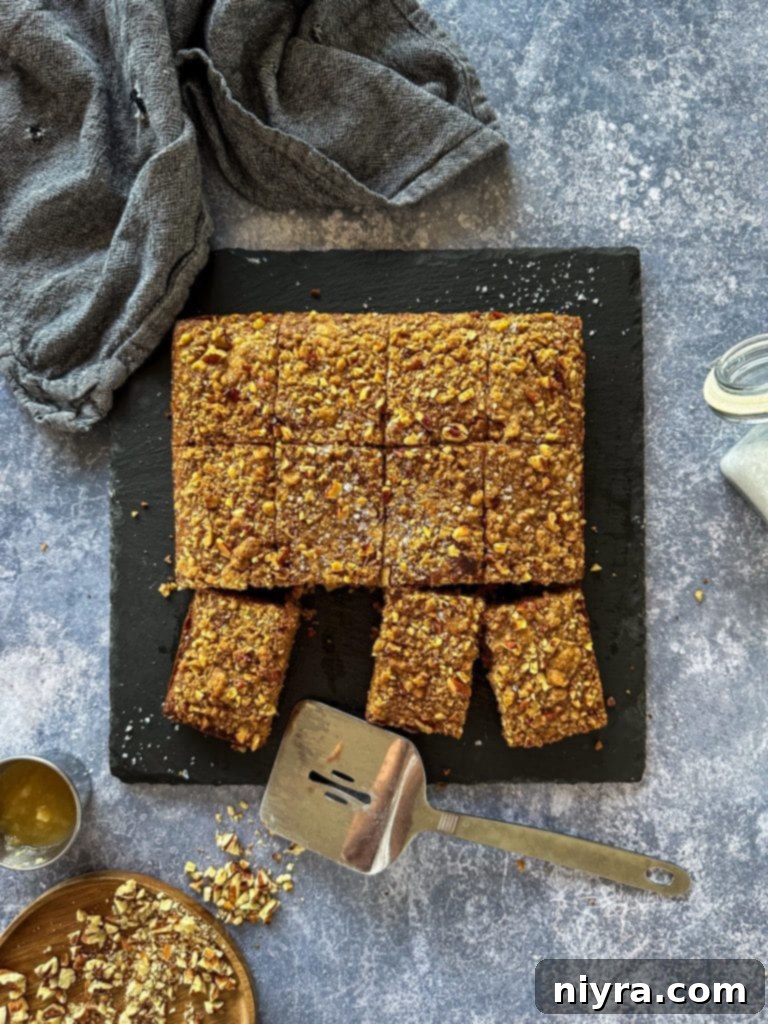 Spiced Applesauce Crumb Cake 2 Moist Applesauce Coffee Cake with Pecan Streusel Topping, perfect for breakfast or dessert.