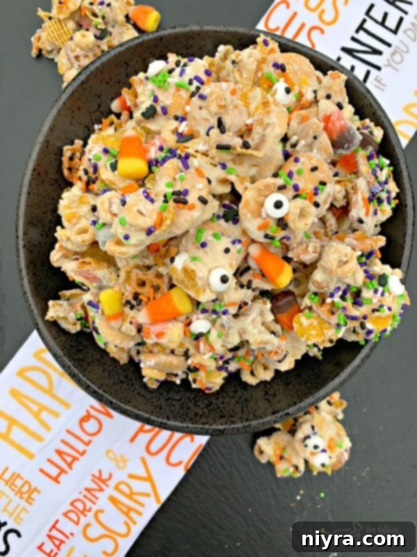 Monster Mash Snack Mix 2 Halloween White Trash Snack Mix - A fun and easy holiday treat with candy corn and candy eyes