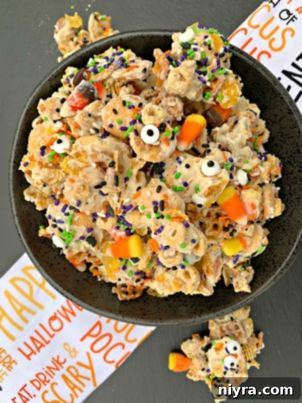 Monster Mash Snack Mix 4 Halloween White Trash Snack Mix ingredients laid out on a table
