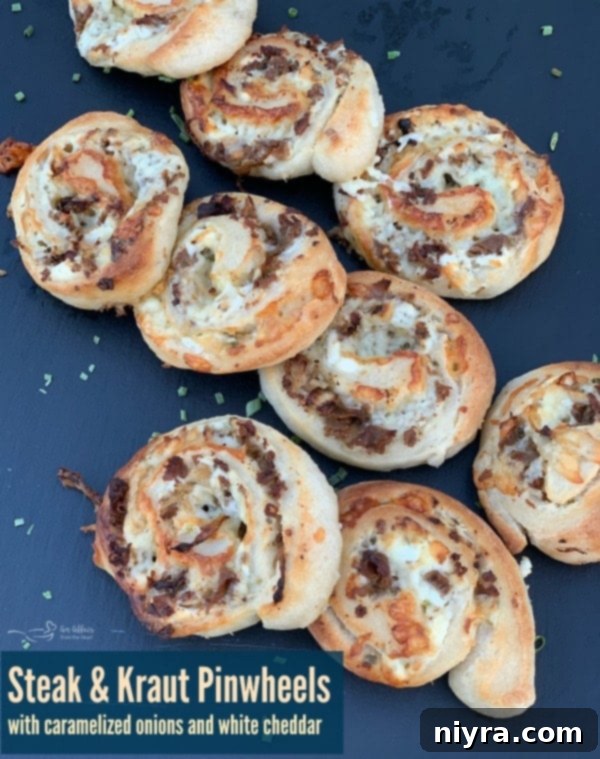 Steak and Kraut Pinwheels with Caramelized Onions and White Cheddar 10 Overhead shot of freshly baked Steak & Kraut Pinwheels, highlighting the golden dough and rich filling