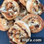 Steak and Kraut Pinwheels with Caramelized Onions and White Cheddar 12 Close up of Steak & Kraut Pinwheels with Caramelized Onions and White Cheddar Cheese