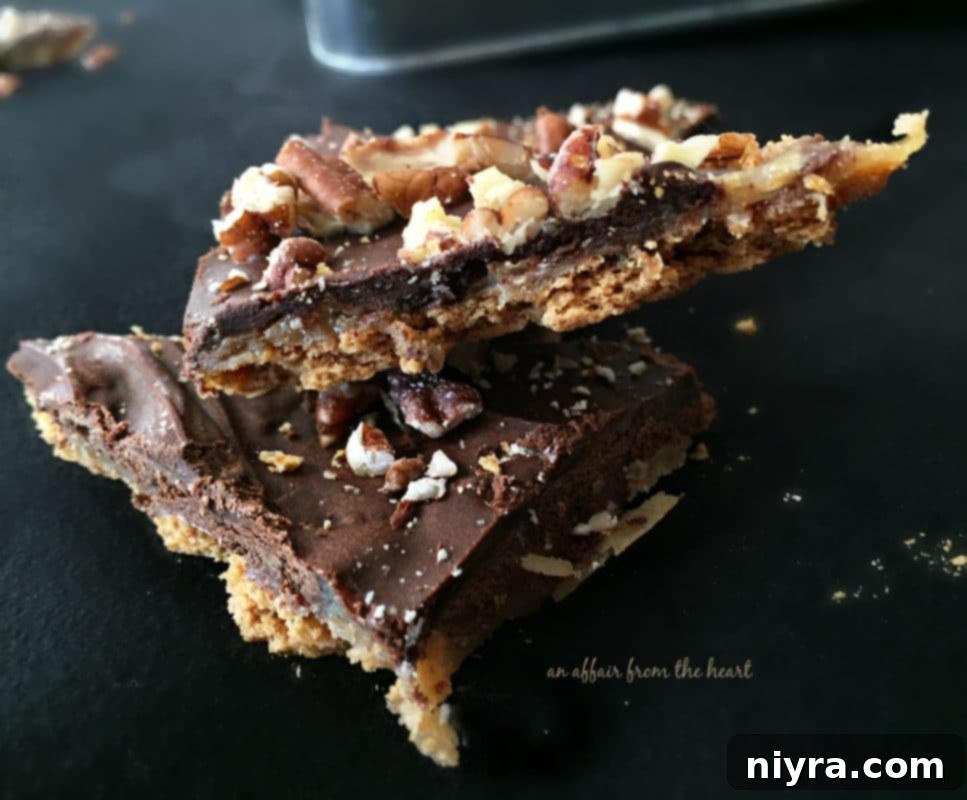 Homemade Graham Cracker Toffee scattered with chopped pecans