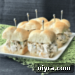 Side view of Leftover Turkey Salad sliders on a white plate