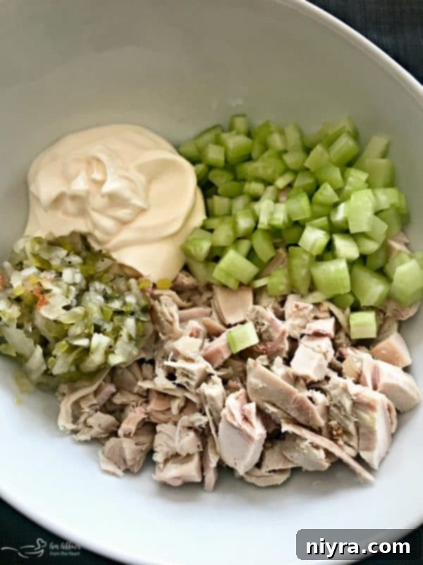 Ingredients for Turkey Salad including chopped turkey, celery, and sweet pickle relish
