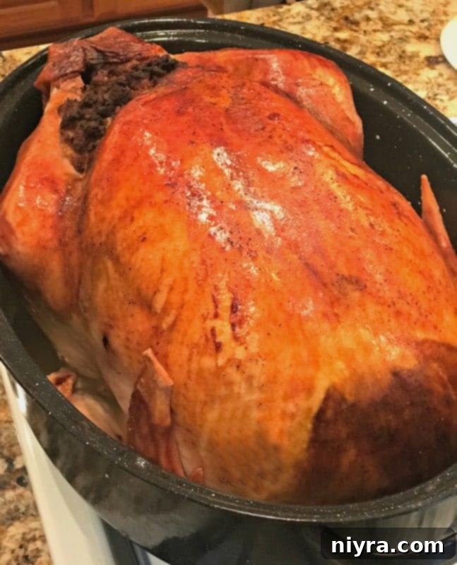 A beautifully roasted whole turkey, golden brown and ready for carving