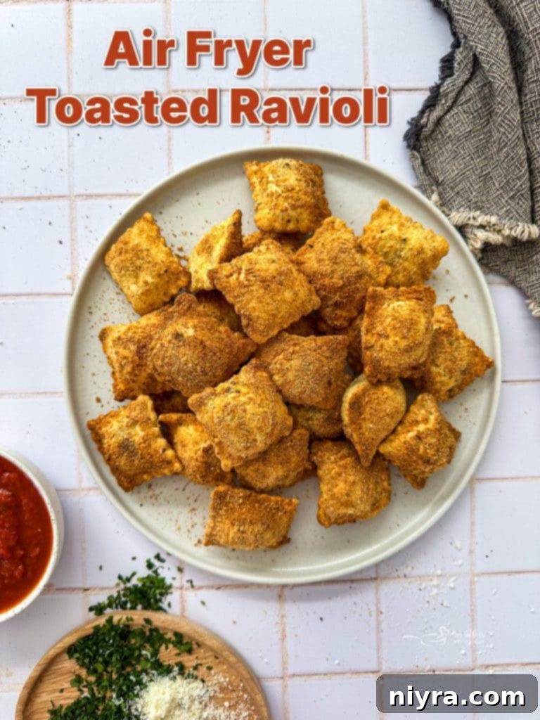 Large image of golden Air Fryer Toasted Ravioli with dipping sauce, ready to eat.