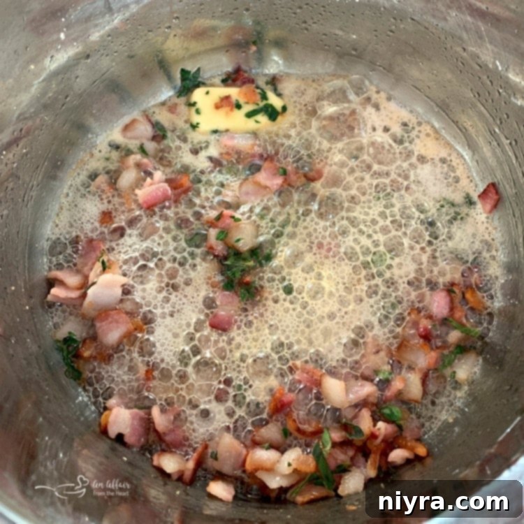 Creamy Instant Pot New England Clam Chowder 7 Bacon cooking in an Instant Pot on sauté mode
