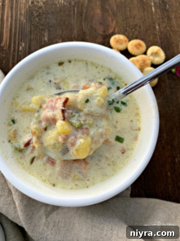 Creamy Instant Pot New England Clam Chowder 9 Instapot New England Clam Chowder served in a bowl with a spoon