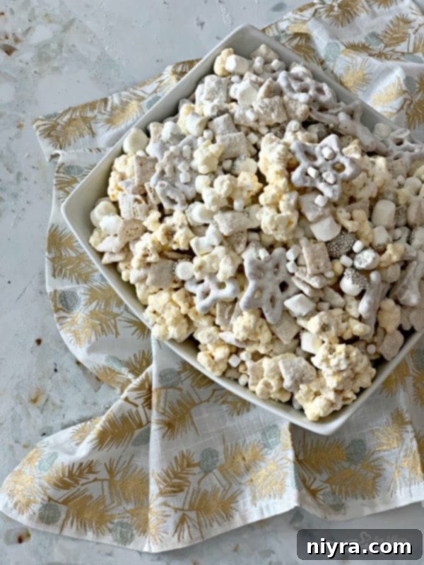 Bowl of Winter Wonderland Snack Mix, showcasing all its white and sparkling components