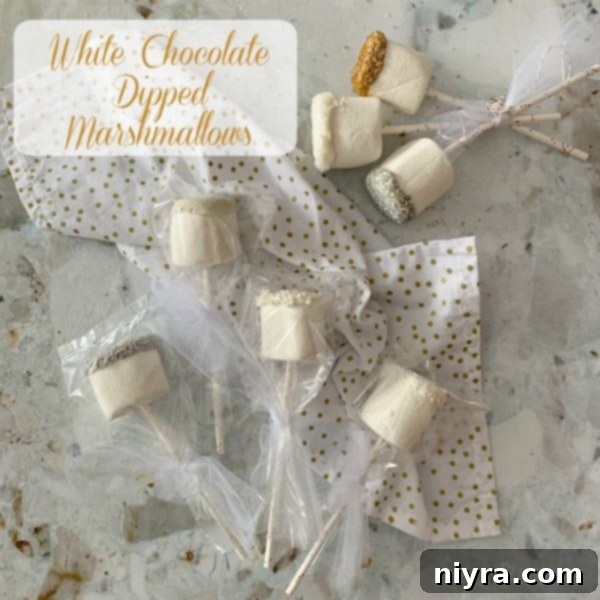 White chocolate-dipped marshmallows with sprinkles, a key component of the Winter Wonderland Snack Mix