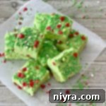 Grinch Fudge stacked on parchment paper