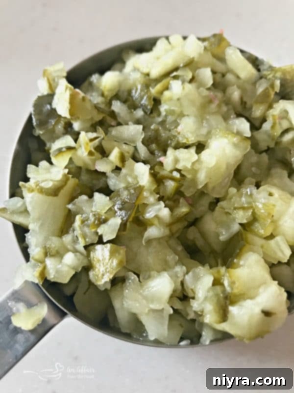 Dried beef being chopped for the cheese ball recipe