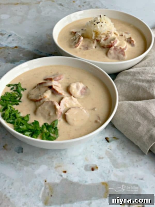 Hearty Instant Pot Beer Cheese Soup with Tangy Kraut and Smoked Kielbasa 2 Instant Pot Beer Cheese Soup with Kraut & Kielbasa - A creamy and comforting soup