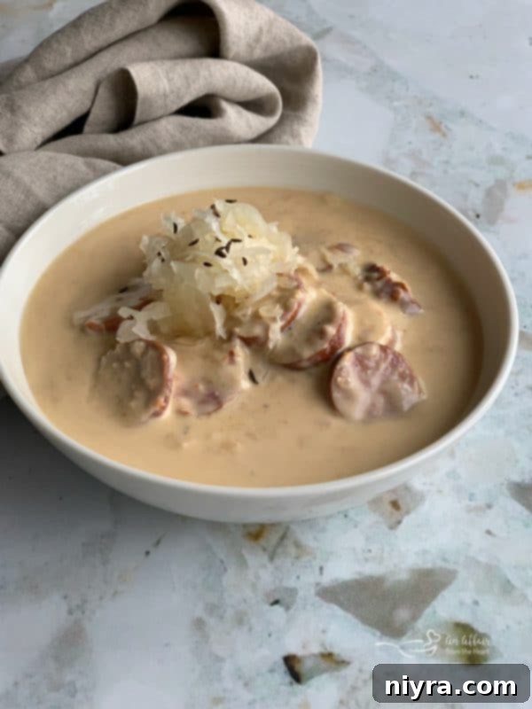 Hearty Instant Pot Beer Cheese Soup with Tangy Kraut and Smoked Kielbasa 9 Beer Cheese Soup topped with more Frank's Kraut and caraway seeds