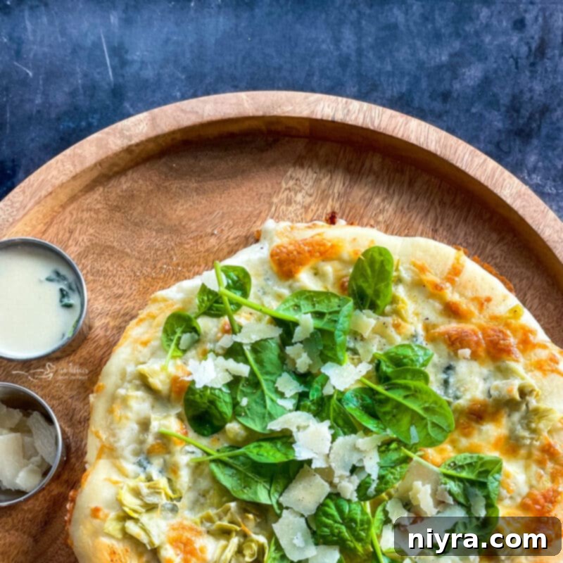 Artichoke Alfredo Pizza, close up of the toppings