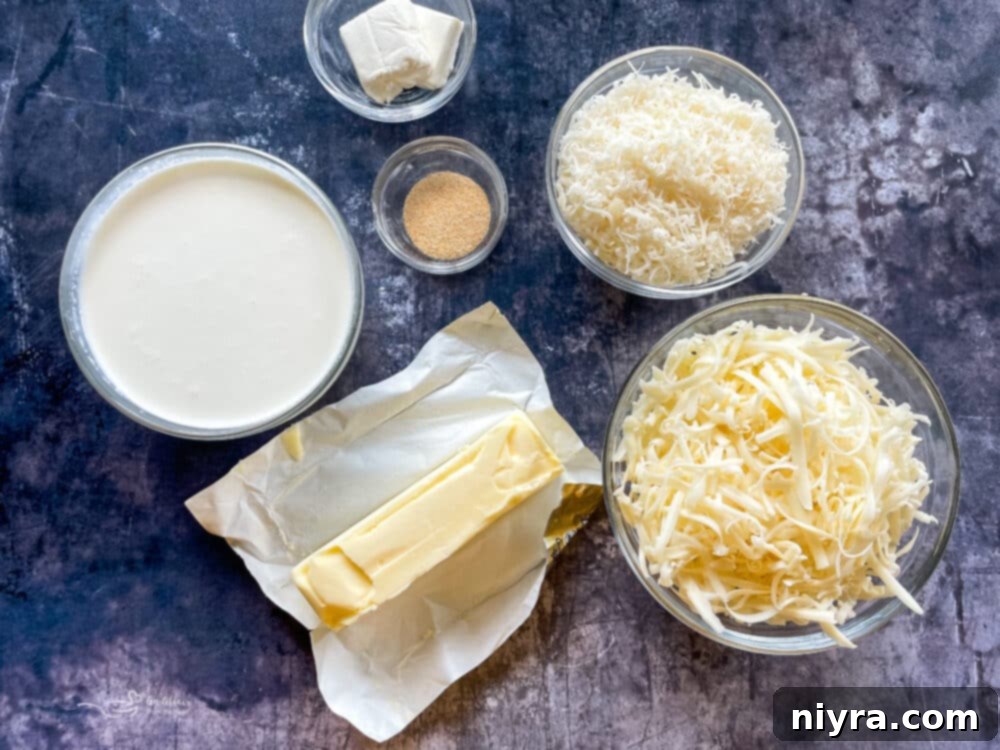Ingredients for Spinach & Artichoke Alfredo Pizza laid out