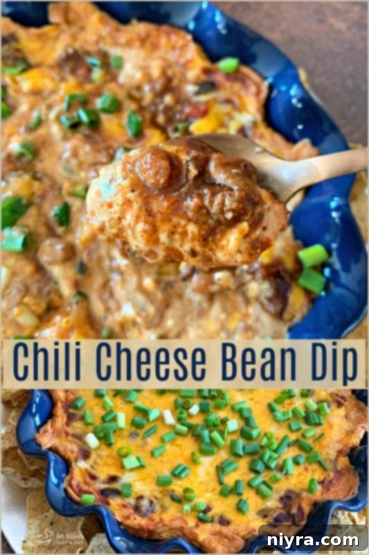 Chili Cheese Bean Dip with a generous scoop on a chip, ready to eat