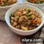Side view of Cauliflower Fried Rice in a white bowl