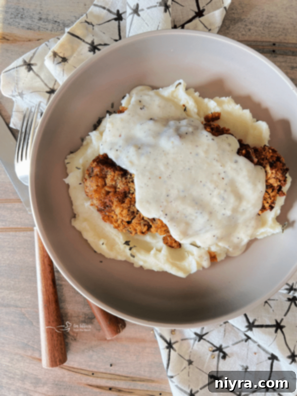 Mantar Soslu Domuz Pirzolası 12 Crispy and tender Air Fryer Chicken Fried Steak covered in peppery white gravy.