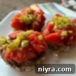 close up Stuffed Pepper Meatloaf Minis on a white plate