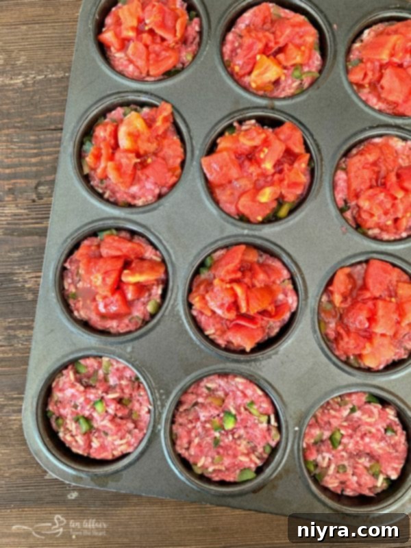 Stuffed Pepper Meatloaf Minis pressed into muffin tin