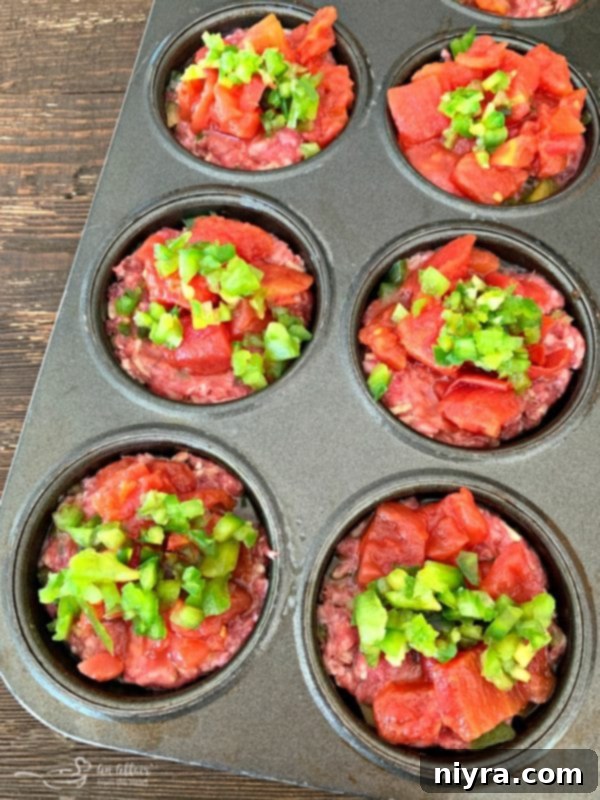 Stuffed Pepper Meatloaf Minis topped with diced tomatoes