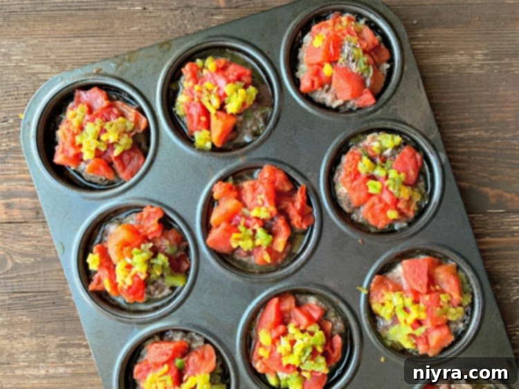 Stuffed Pepper Meatloaf Minis topped with green bell pepper