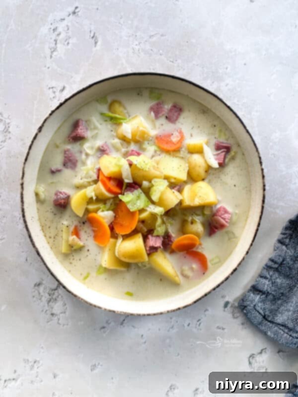 Velvety Corned Beef and Cabbage Soup 3 Creamy Corned Beef & Cabbage Soup in a white bowl