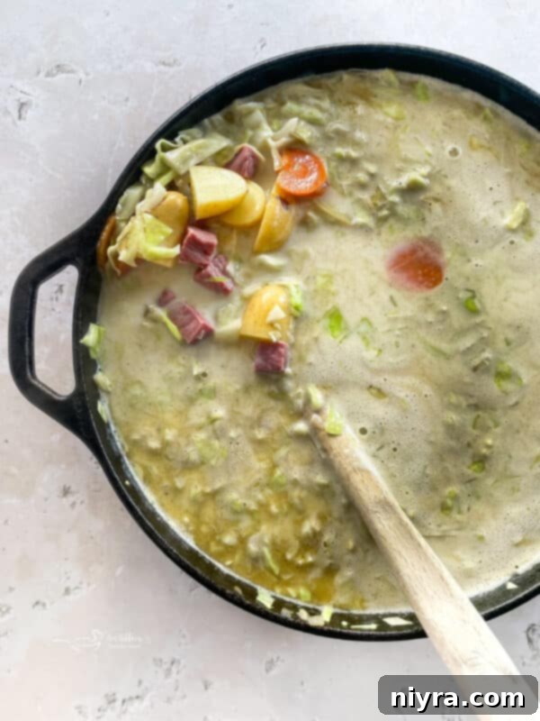 Velvety Corned Beef and Cabbage Soup 10 Adding corned beef and cabbage to the soup