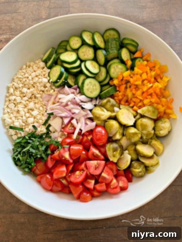 Ingredients for Greek Cauliflower Rice Salad being prepped