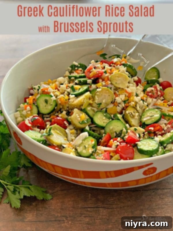 Greek Cauliflower Rice Salad with Brussels Sprouts in a large bowl on a rustic table