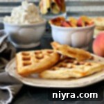 side view Puffles - Puff Pastry Waffles on a white plate