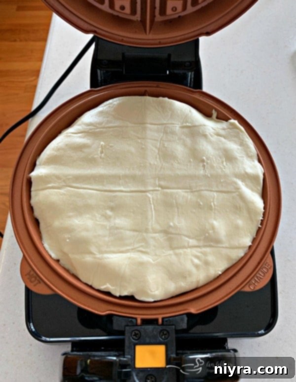 Puff pastry cooking in a Hamilton Beach Flip Belgian Waffle Maker