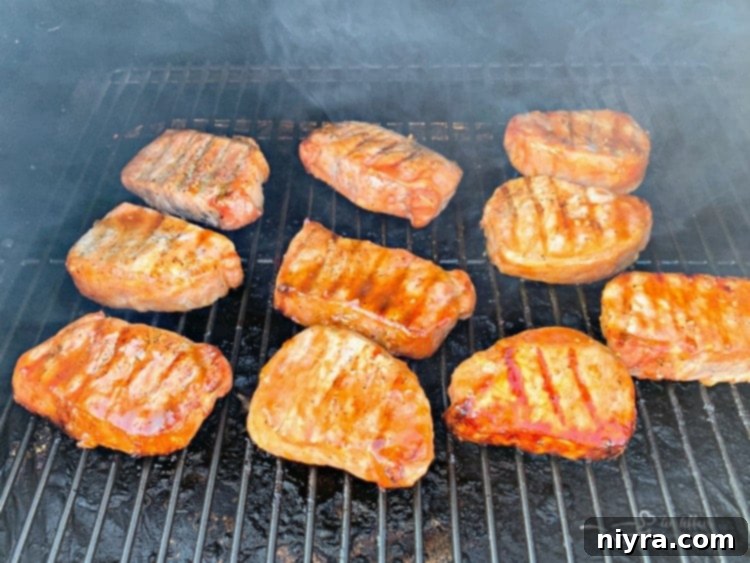 Dorothy's BBQ Pork Chops with sauce on a grill