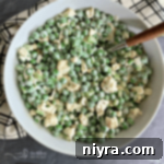 Pea and Cauliflower Medley 14 Overhead of Pea Salad with Cauliflower in a white serving bowl