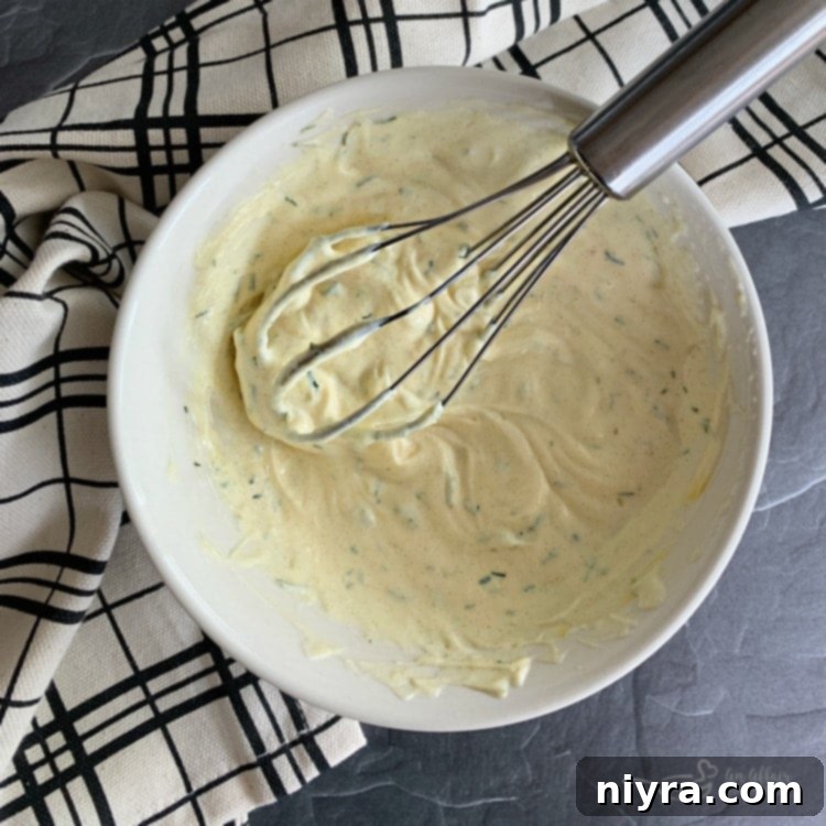 Pea and Cauliflower Medley 6 Creamy dill dressing for pea salad being prepared