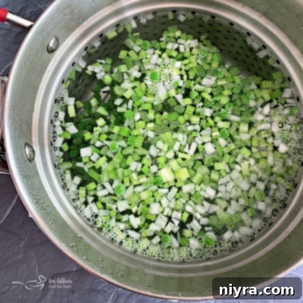 Pea and Cauliflower Medley 7 Peas, onion, and celery blanching in boiling water