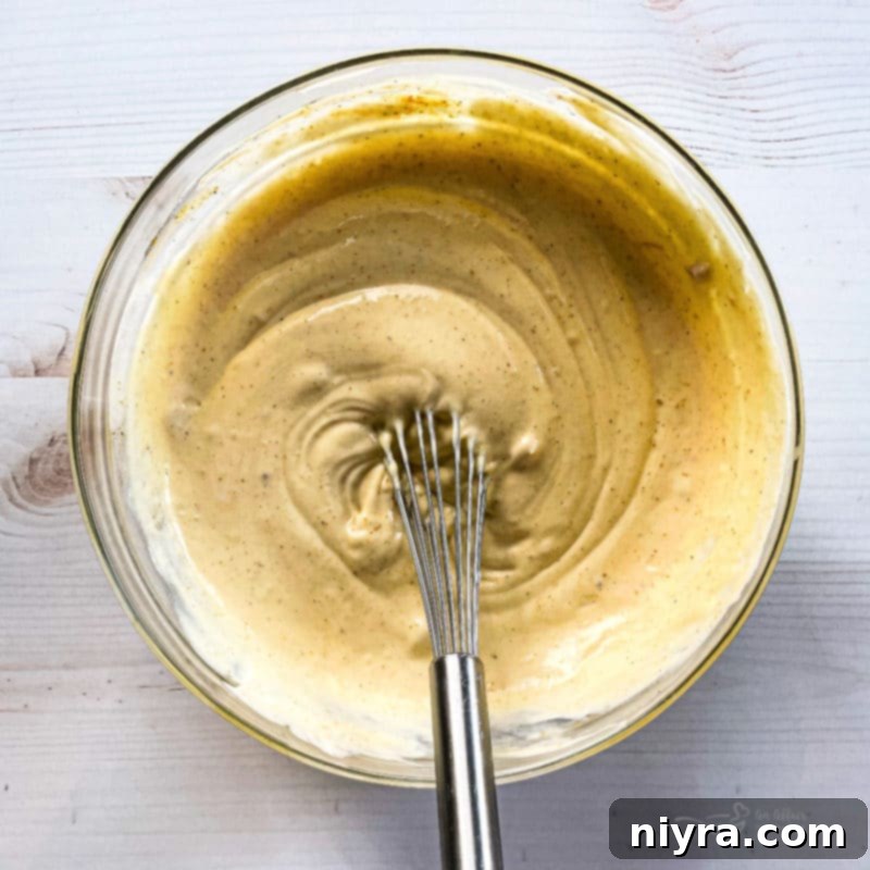 Fresh ingredients for Chicken Divan casserole laid out on a board